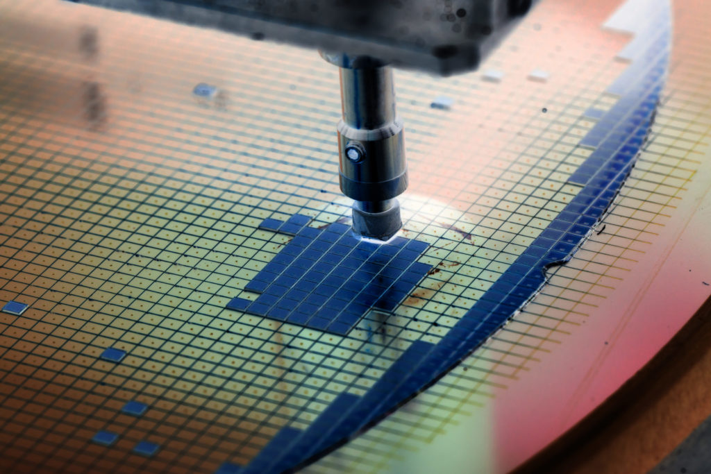 Silicon wafers being attached to a die.