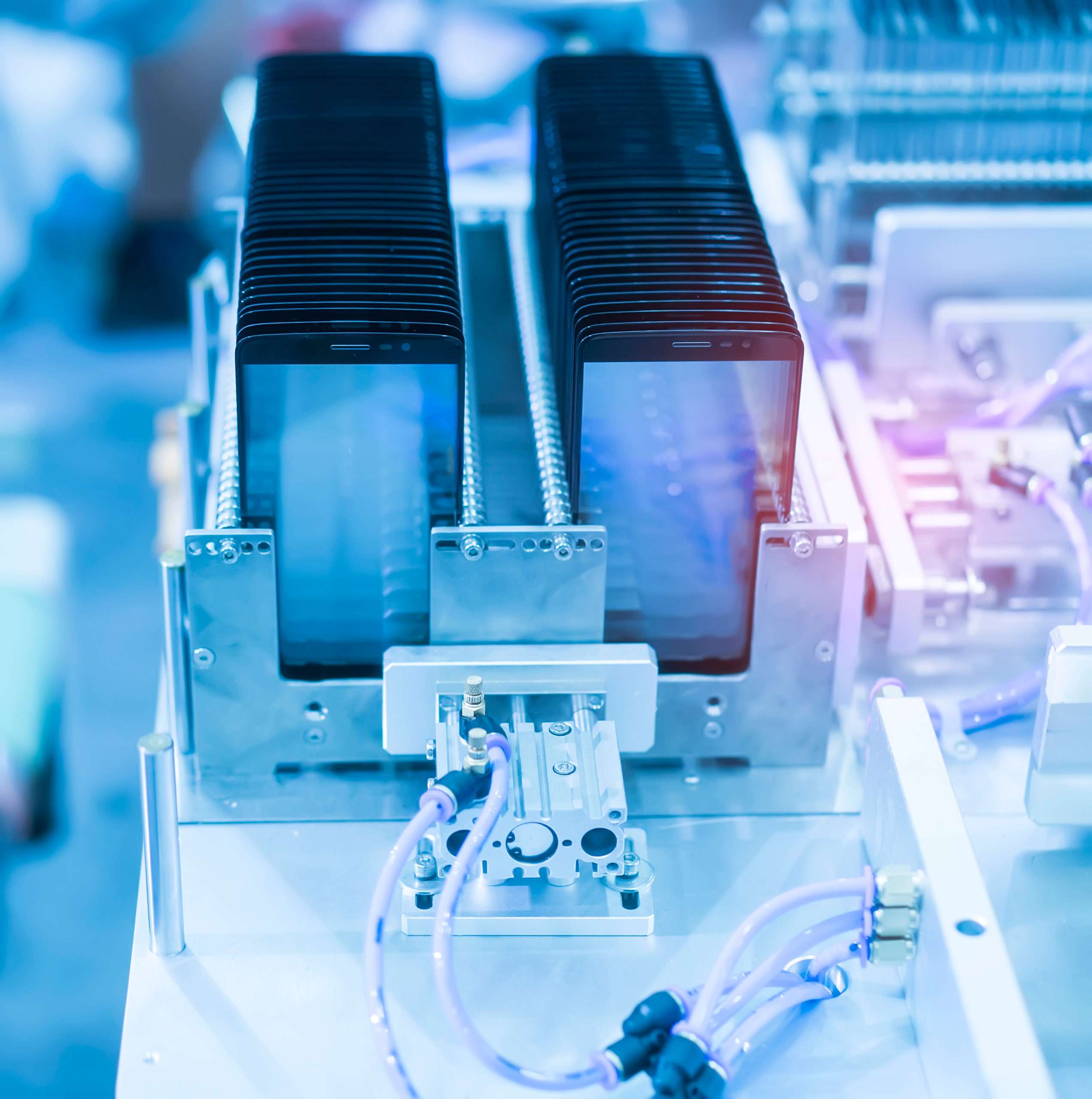 Phones with LCD screens being assembled in a manufacturing plant cleanroom 