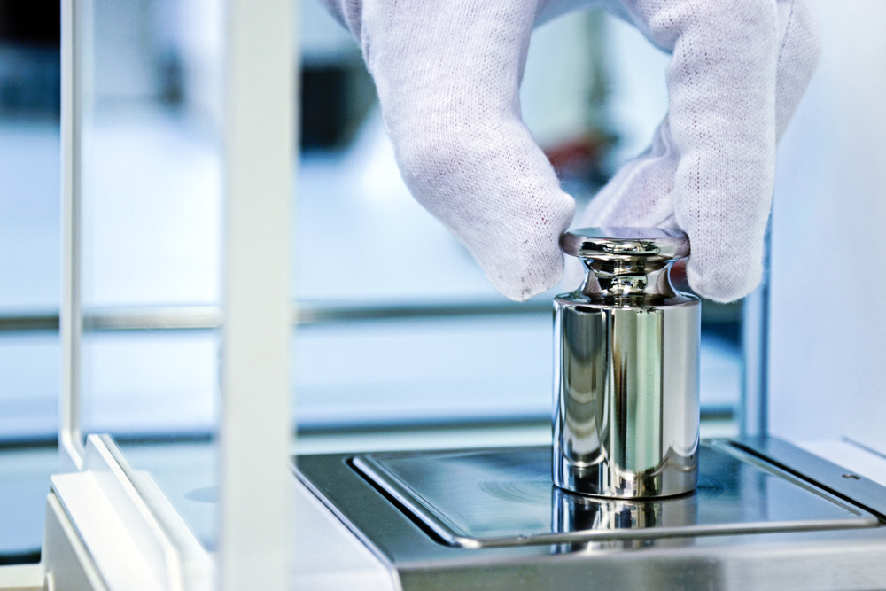 Calibration of a scale in a cleanroom environment